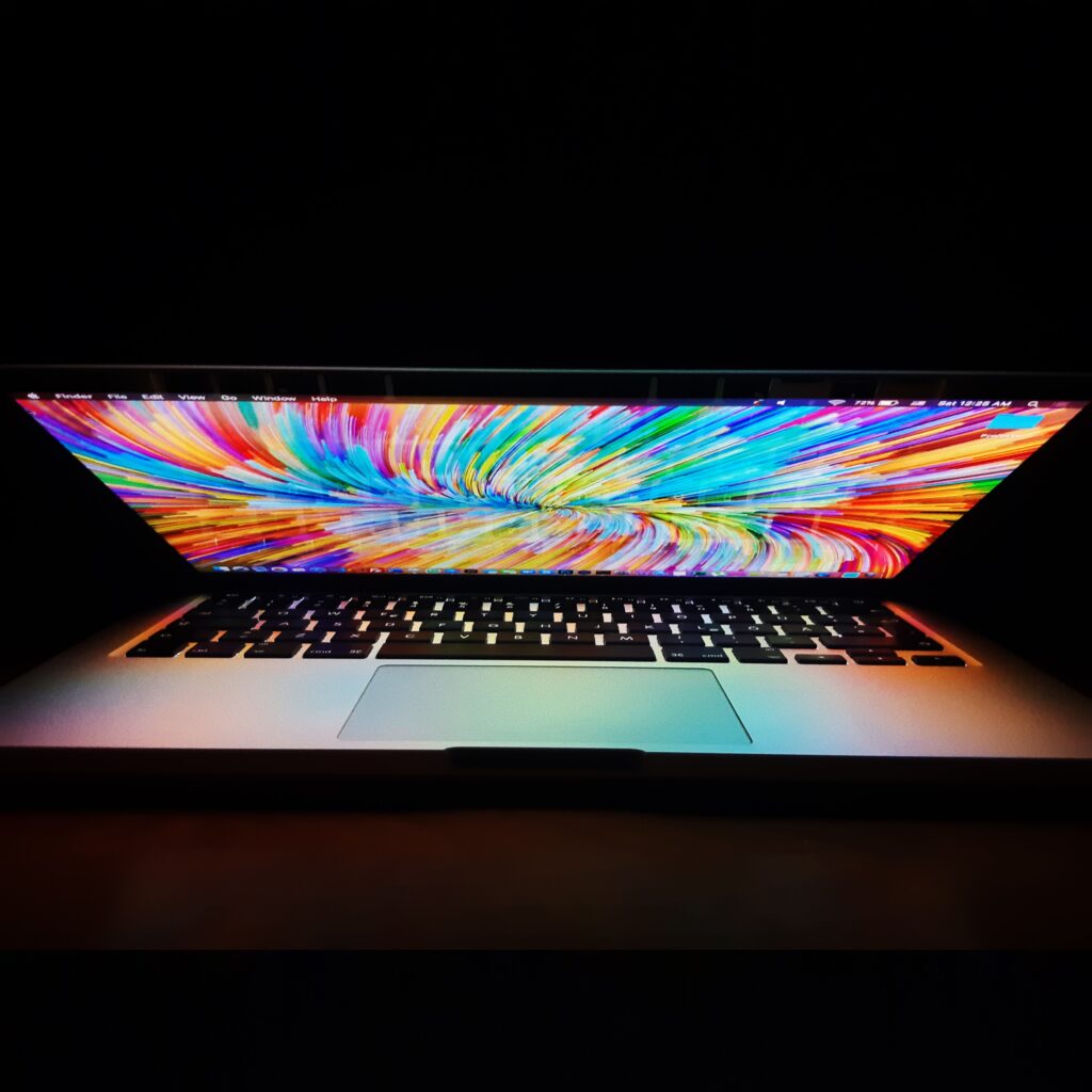 Laptop with rainbow swirl screen